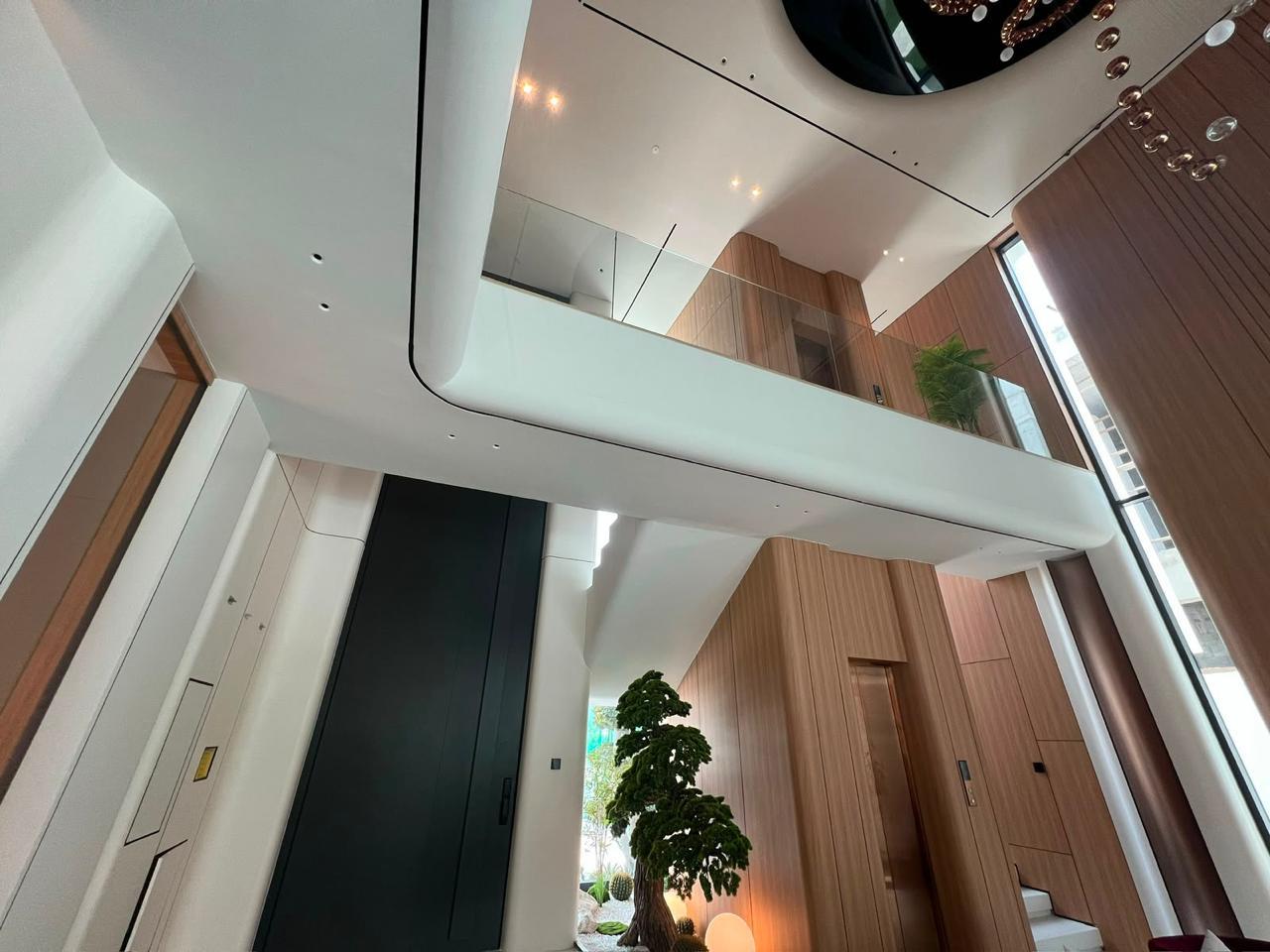 Contemporary double-height villa interior completed by Velaris